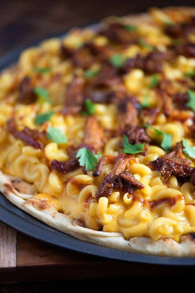 Macaroni and cheese pizza topped with pulled pork.
