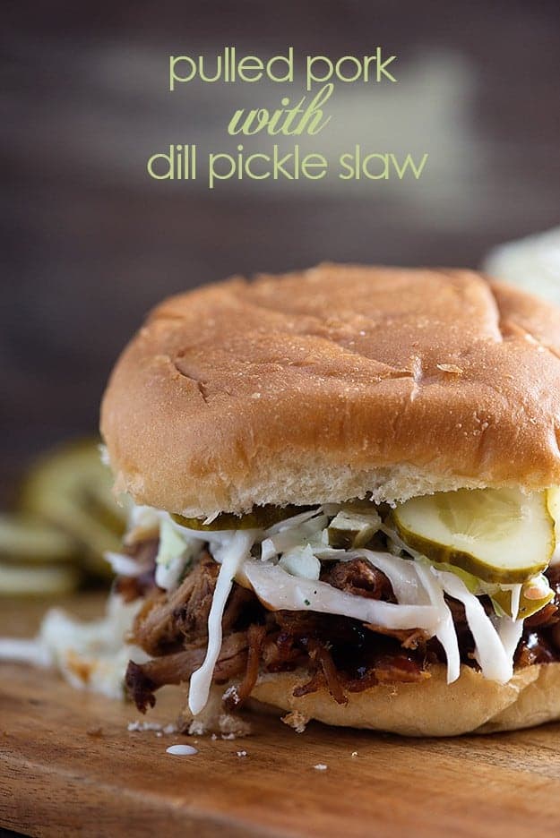 Slow cooker pulled pork made in the crock pot! Perfect for these easy sandwiches with dill pickle slaw and homemade barbecue sauce! This is one of our favorite recipes!