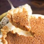 Brown sugar pie being scooped up from the pie pan.