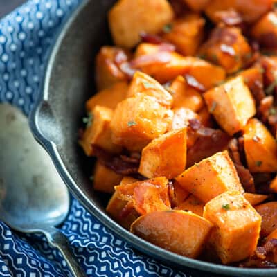 Sweet potatoes in a bowl cut into cubes.
