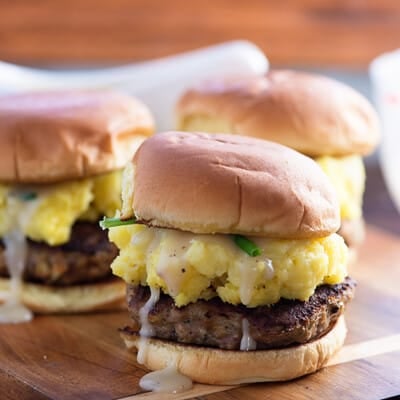 A close up of mashed potato and gravy burger.