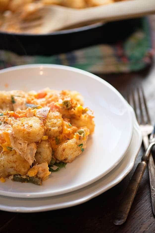 A tater tot casserole on a round white plate.