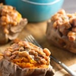 These crock pot baked beans are loaded with diced ham! Serve them over baked sweet potatoes for an easy dinner!