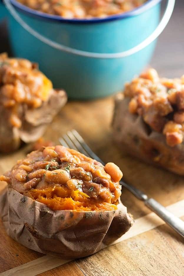 These crock pot baked beans are loaded with diced ham! Serve them over baked sweet potatoes for an easy dinner!