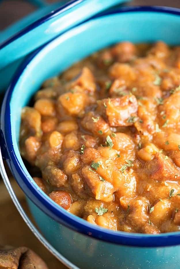 These crock pot baked beans are loaded with diced ham! Serve them over baked sweet potatoes for an easy dinner!