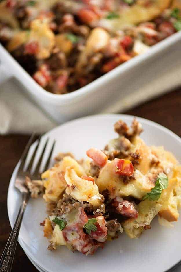 Mexican Breakfast Casserole - loaded with bagels, cheese, sausage, and tomatoes with chiles! Such an easy, cheesy way to get breakfast on the table!