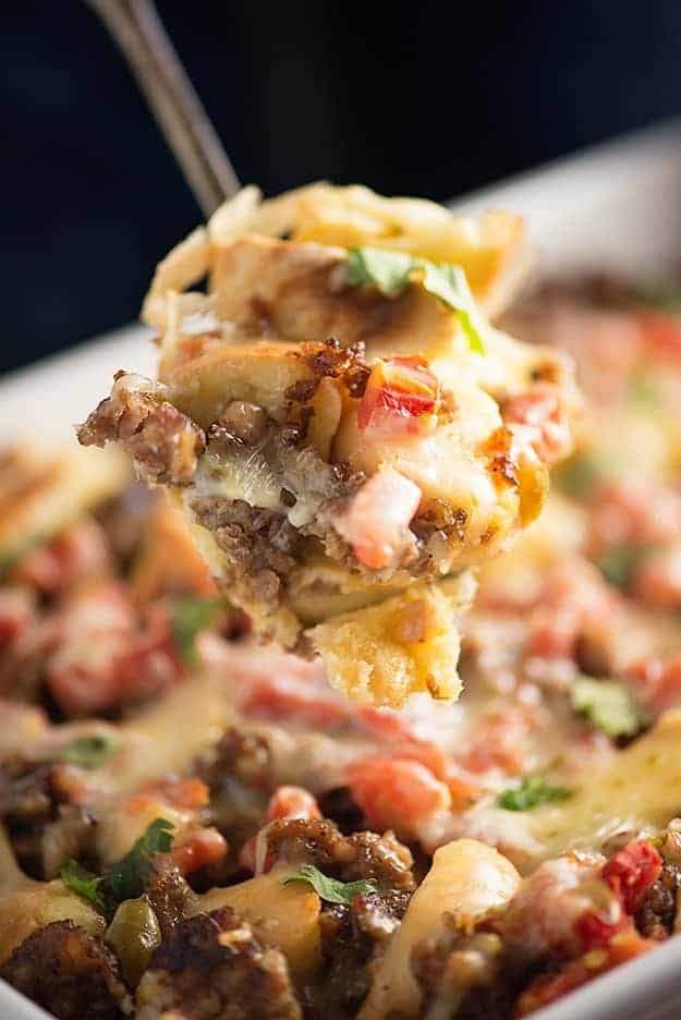 Mexican Breakfast Casserole - loaded with bagels, cheese, sausage, and tomatoes with chiles! Such an easy, cheesy way to get breakfast on the table!