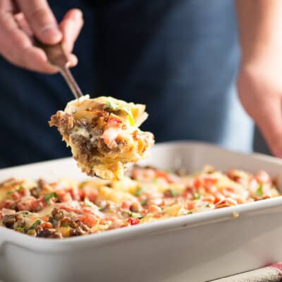 Mexican Breakfast Casserole - loaded with bagels, cheese, sausage, and tomatoes with chiles! Such an easy, cheesy way to get breakfast on the table!