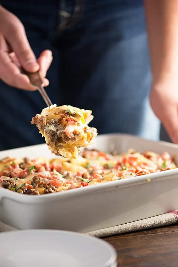 Mexican Breakfast Casserole - loaded with bagels, cheese, sausage, and tomatoes with chiles! Such an easy, cheesy way to get breakfast on the table!