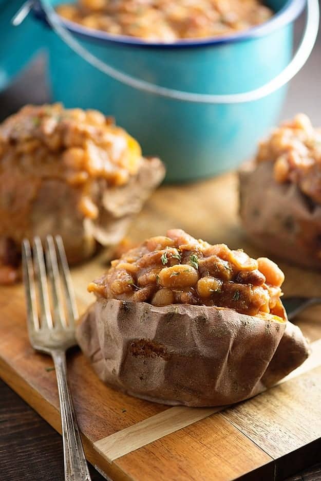 These crock pot baked beans are loaded with diced ham! Serve them over baked sweet potatoes for an easy dinner!