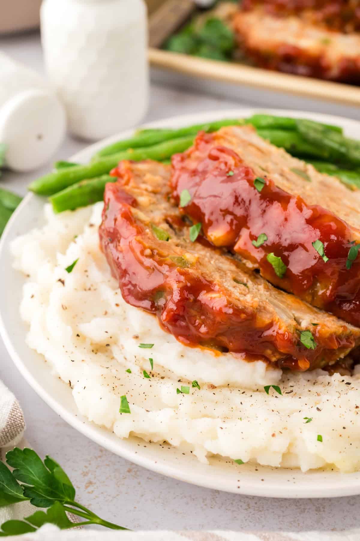 overhead view of baked turkey meatloaf on sheet pan.