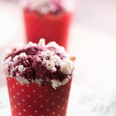 Red velvet muffin wrapped with a polka dot muffin paper.