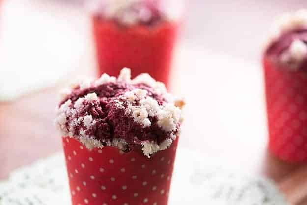 Red velvet muffin wrapped with a polka dot muffin paper.