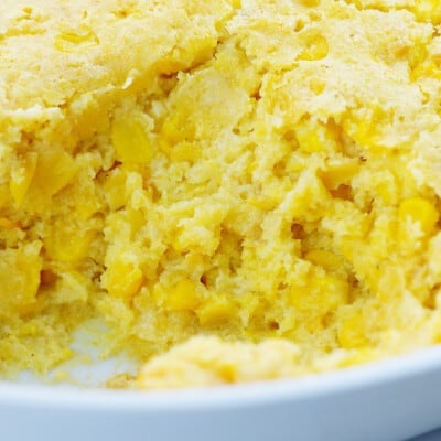 cornbread casserole in white dish.