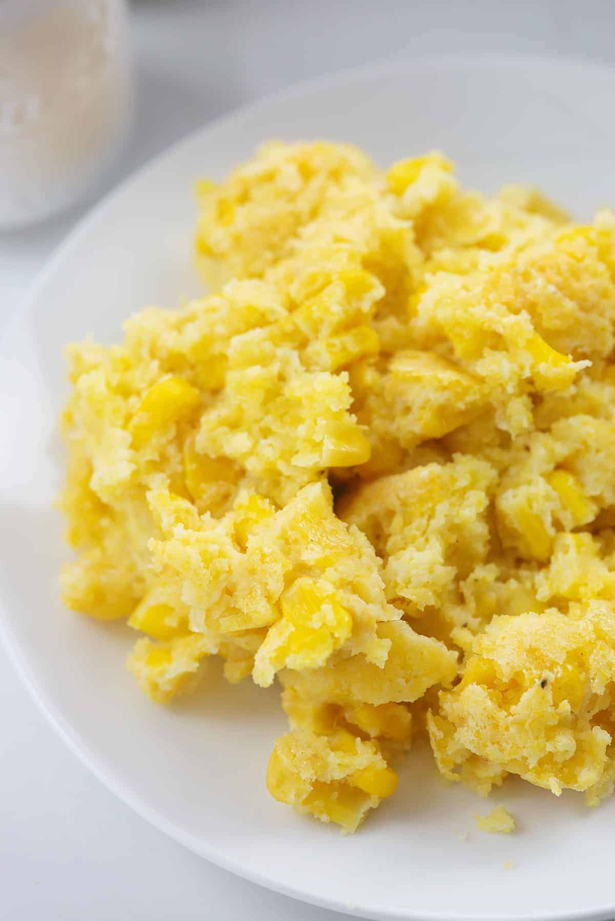 pile of Jiffy corn casserole on white plate.