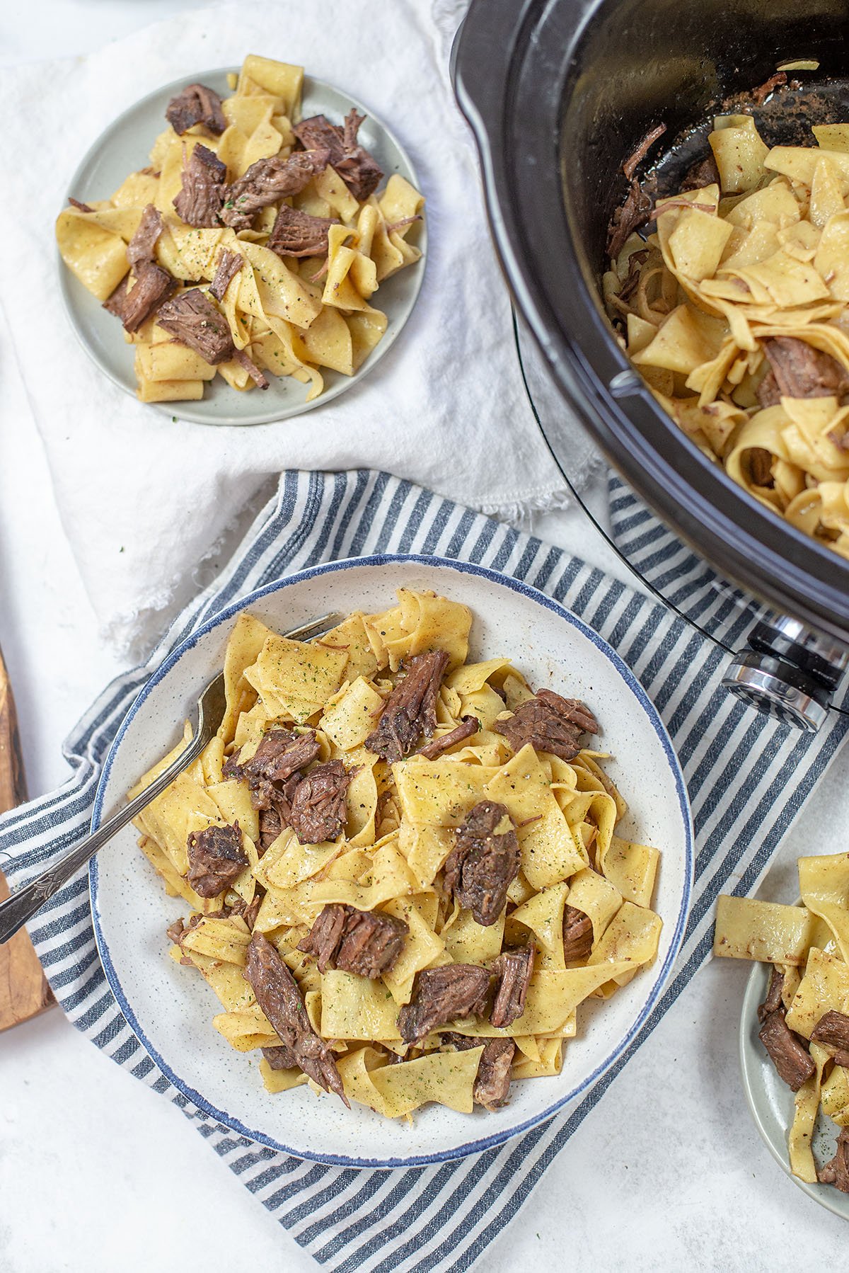 overhead view of beef and noodles in bowl.