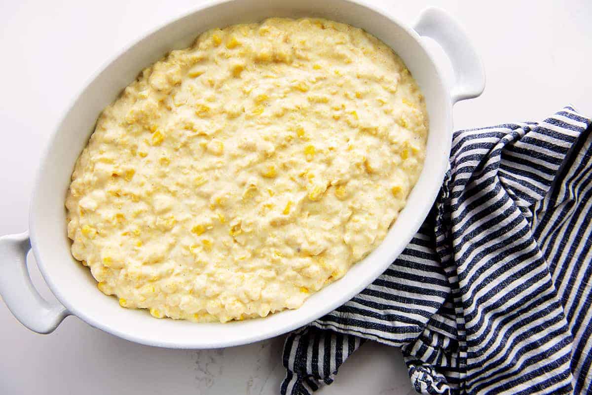 corn casserole in white baking dish.