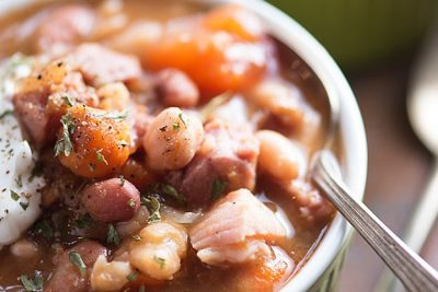 A cup of ham and bean soup.