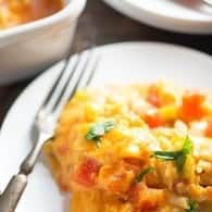 This King Ranch Casserole is packed with chicken, Ro*Tel, plenty of cheese, and corn tortillas. It's one of our favorite Mexican casserole recipes!