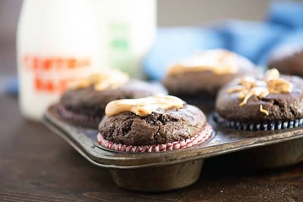 These moist chocolate muffins are filled with a creamy peanut butter center! These are the muffins of my dreams!!
