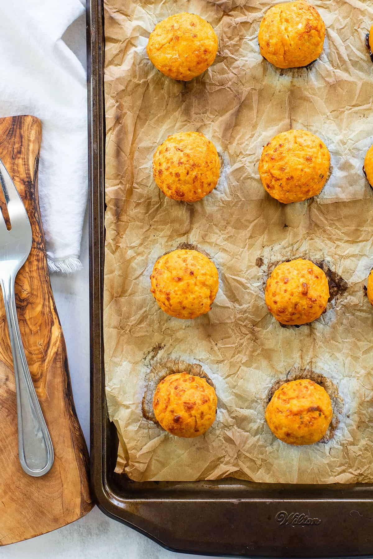 baked buffalo chicken meatballs on sheet pan.