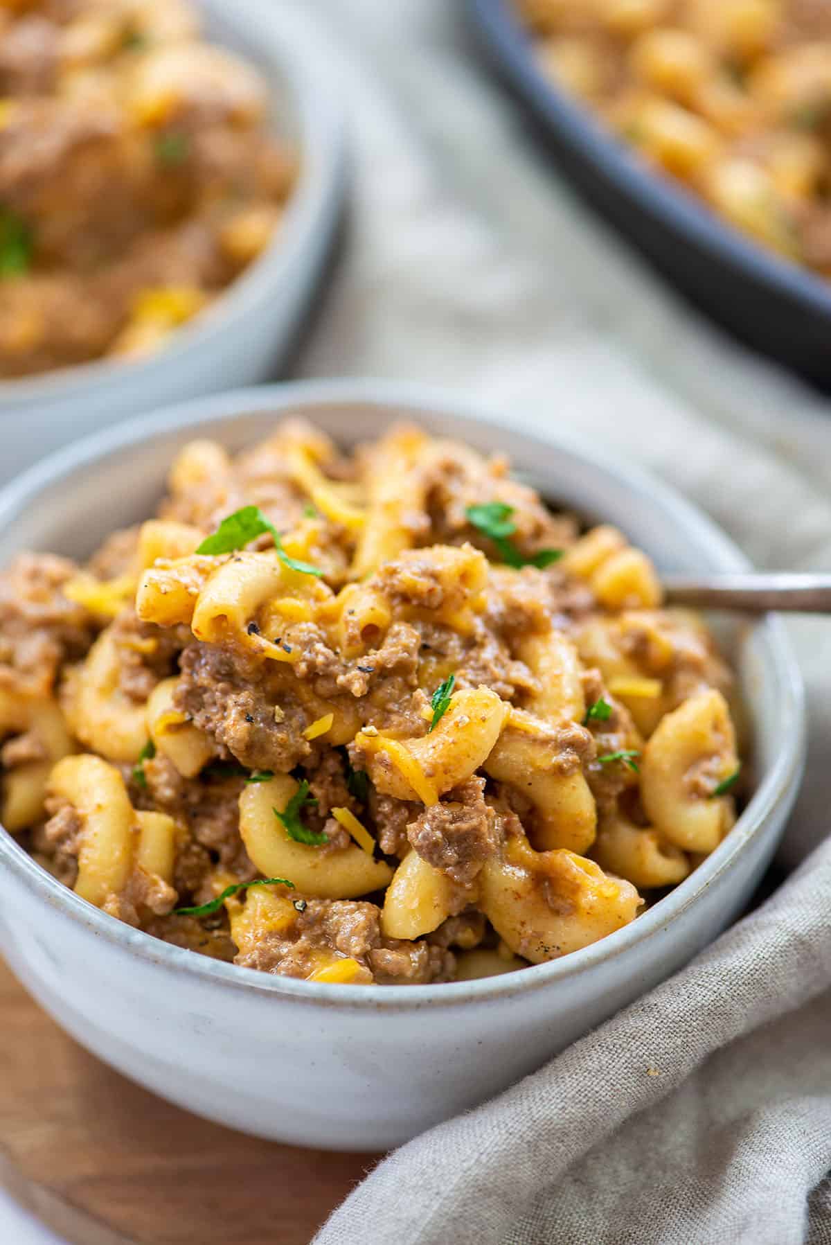 homemade hamburger helper in white bowls.