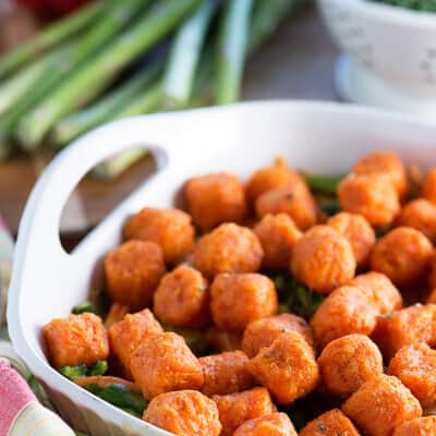 Tatertots in a white baking dish.