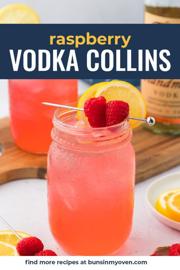 Vodka collins with fresh raspberry and lemon in mason jar.