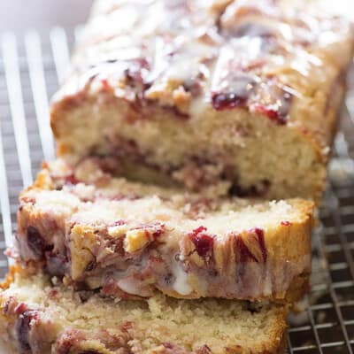 A loaf of raspberry brad on a cooling rack.