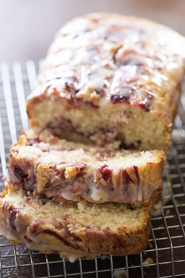 A loaf of raspberry brad on a cooling rack.