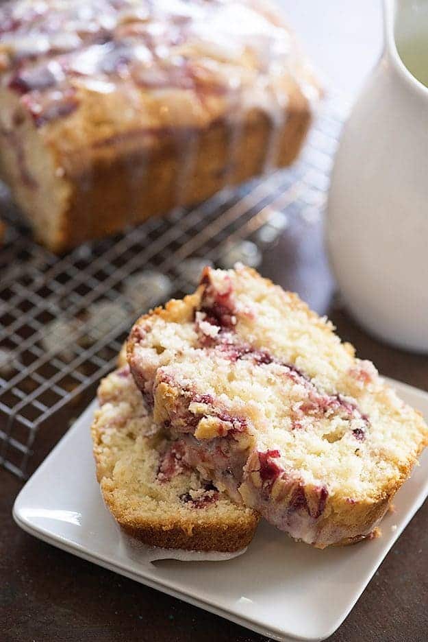 Two slices of muffin bread on a square plate.