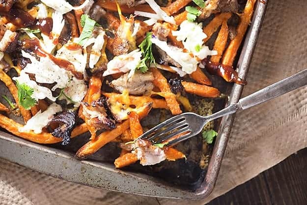 A baking sheet of loaded sweet potatoes.