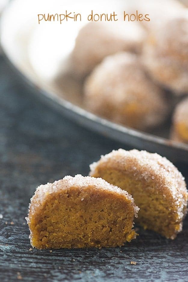 Baked pumpkin donut holes! These are dense like a pumpkin pie, but coated in butter, cinnamon, and sugar so they taste like a fried donut!
