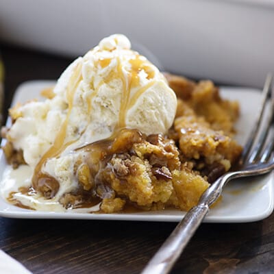 This pumpkin crunch cake has a cake topping with a bottom made of pumpkin pie filling! I couldn't stop sneaking bites of this cake!