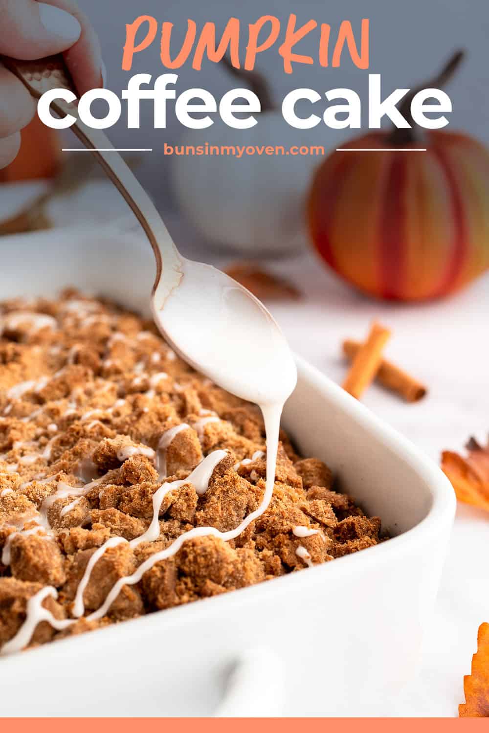 Spoon drizzling glaze over pumpkin coffee cake recipe.