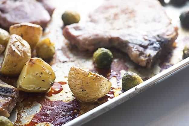 A close up of a potato on a baking sheet.