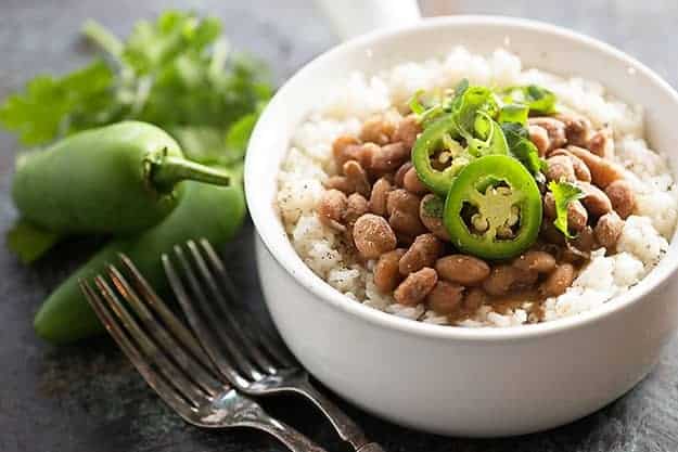 Tex-Mex pinto beans in the pressure cooker! These Instant Pot pinto beans are done so much faster than traditional beans! 