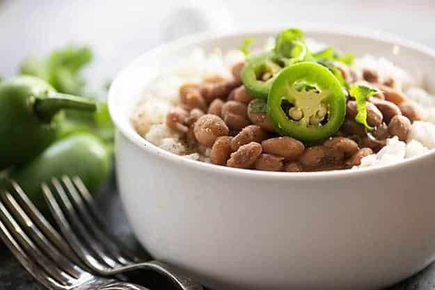 Tex-Mex pinto beans in the pressure cooker! These Instant Pot pinto beans are done so much faster than traditional beans! 