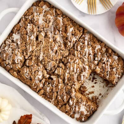 Sliced coffee cake in white pan.