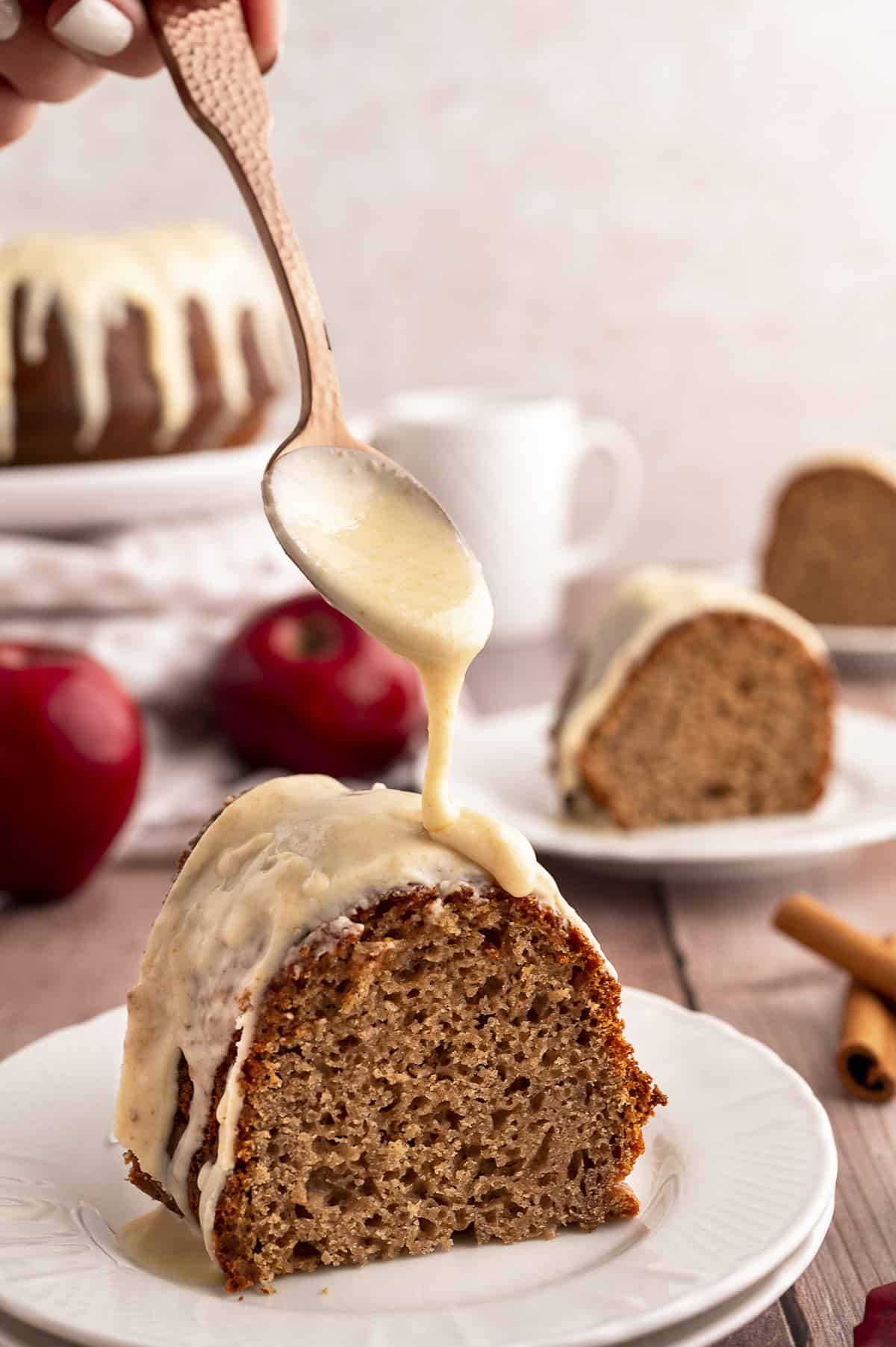 Browned butter being drizzled over applesauce cake.