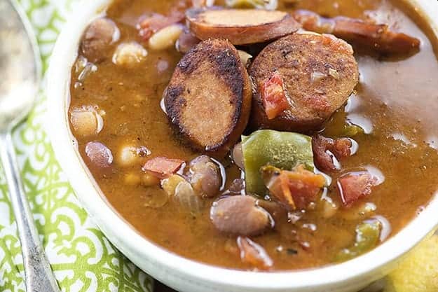 A bowl sausage and bean soup.