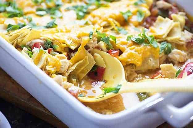 This Mexican chicken casserole recipe is perfect for a busy weeknight. Just a handful of ingredients and it bakes up in no time! We love the cheesy layers!