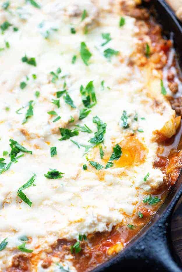 Lasagna in a cast iron skillet.