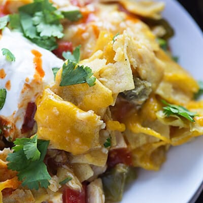 This Mexican chicken casserole recipe is perfect for a busy weeknight. Just a handful of ingredients and it bakes up in no time! We love the cheesy layers!