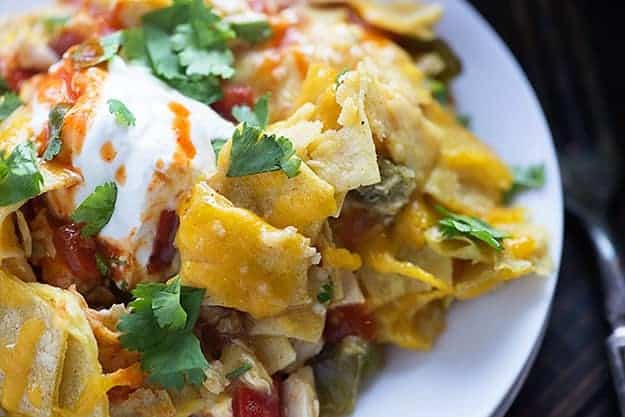 This Mexican chicken casserole recipe is perfect for a busy weeknight. Just a handful of ingredients and it bakes up in no time! We love the cheesy layers!