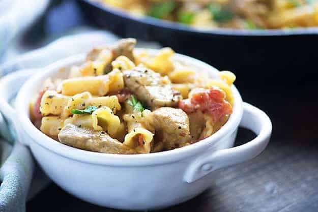 This one dish pasta recipe is loaded with pork, tomatoes, cheese, and onions for a quick dinner recipe that is ready in less than 30 minutes!