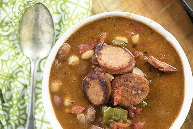 Overhead view of a cup of cajun sausage soup.
