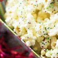 This white chocolate Christmas popcorn is one of my favorite holiday treats! It's so easy and everyone loves to munch on it!