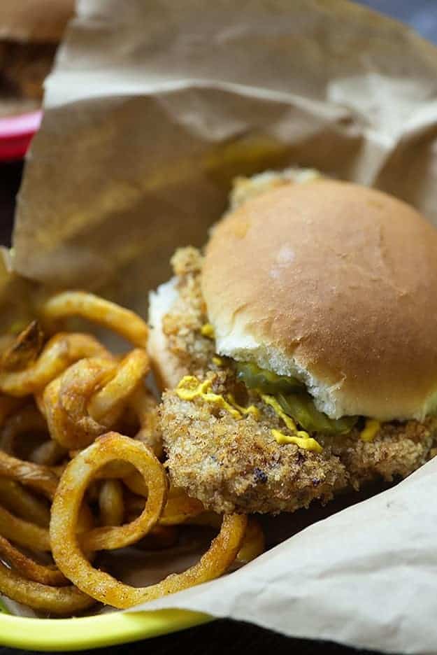 These crispy pork tenderloin sandwiches are fried right in the oven to make life easy! pork tenderloin sandwiches with fries