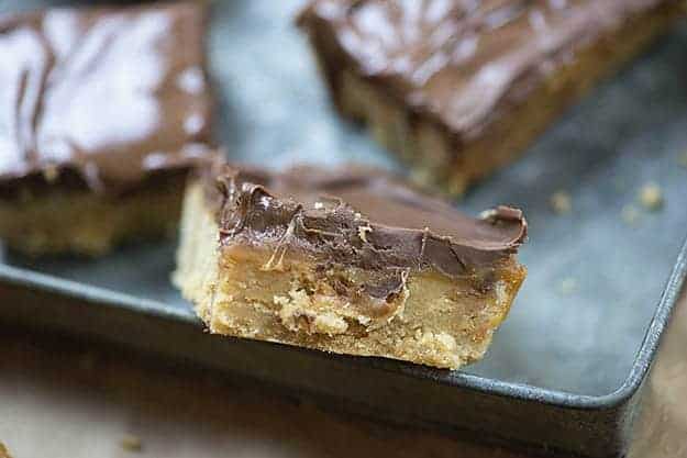 Chocolate peanut butter bars on a baking sheet.